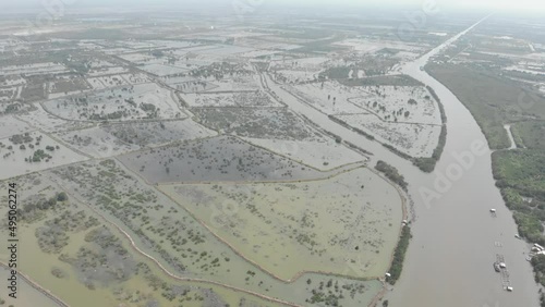 Aerial view of Mekong River delta region in Ha Tien, Vietnam, scenic river branches and water canals flooding on the rice fields