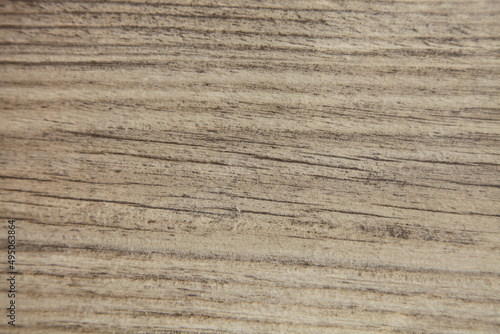 Wood texture with striped pattern. Light grey background.