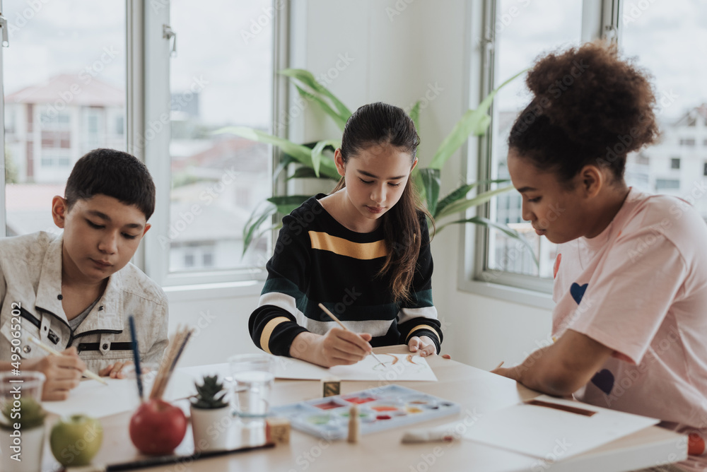 Group of students learning art lesson in classroom. Kids learning drawing lesson with friends. Education concept. Group of students learning art lesson in classroom. Kids learning drawing lesson with friends. Education concept.