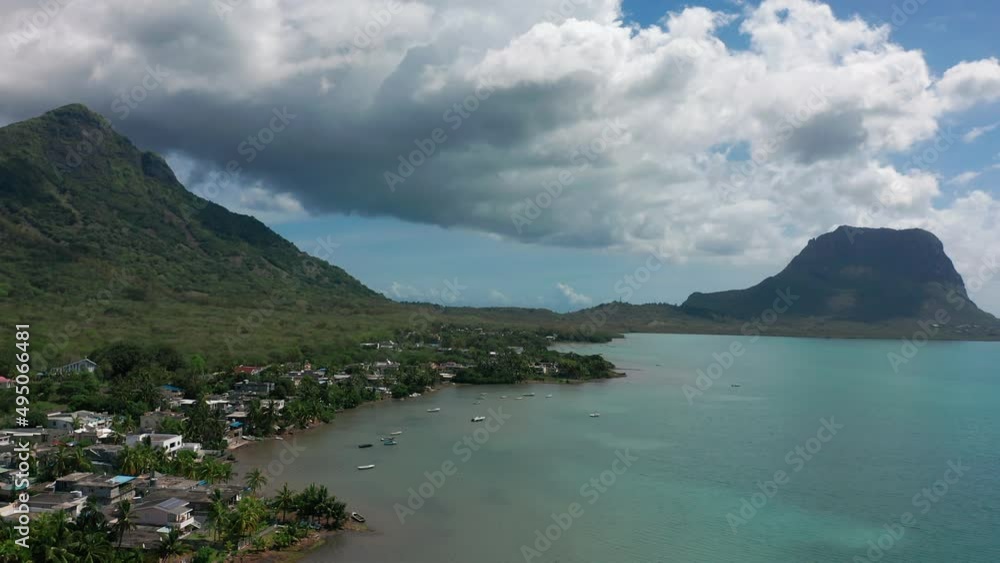 A bird's-eye view of the exotic coast of the island of Mauritius. People enjoy the clear tropical water and beaches A bird's-eye view of the exotic coast of the island of Mauritius. People enjoy the clear tropical water and beaches