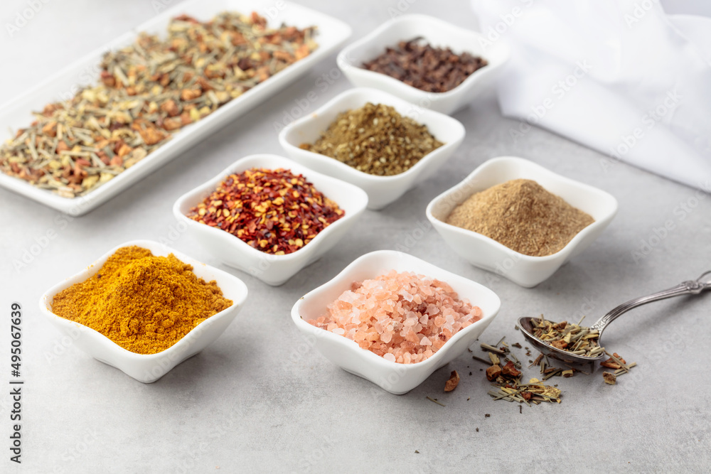 Various spices on a kitchen table. Various spices on a kitchen table.