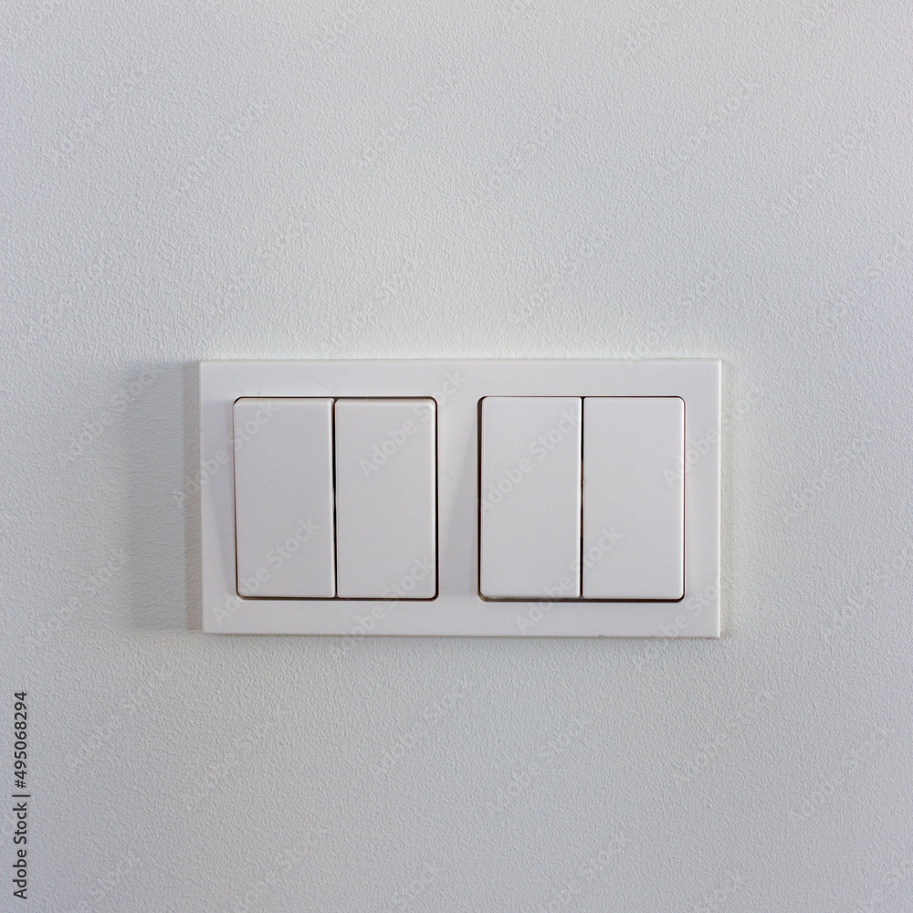 White light switches on a white wall White light switches on a white wall