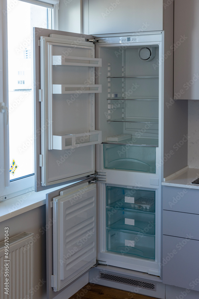Home refrigerator with empty shelves. Lack of products. Home refrigerator with empty shelves. Lack of products.