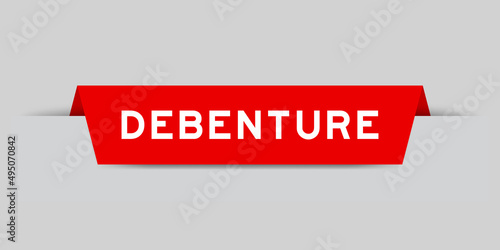 Red color inserted label with word debenture on gray background