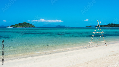 Scenic white sand beach tropical paradise island with crystal clear turquoise sea water and coral reef against blue sky in summer. Koh Mak Island  Trat  Thailand.