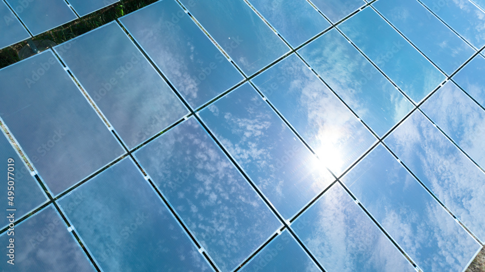 Aerial top view of solar panels or solar cells farm, renewable energy source. Ecotechnology for electric power in the industry. Aerial top view of solar panels or solar cells farm, renewable energy source. Ecotechnology for electric power in the industry.