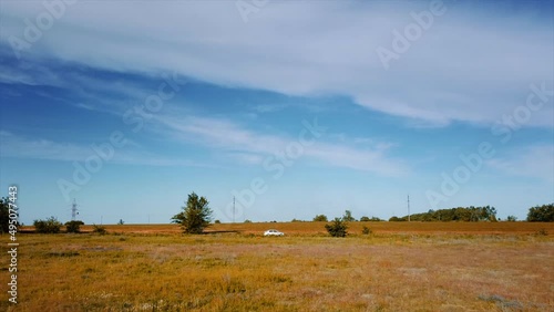 Drone shot of car in Ukrainian field