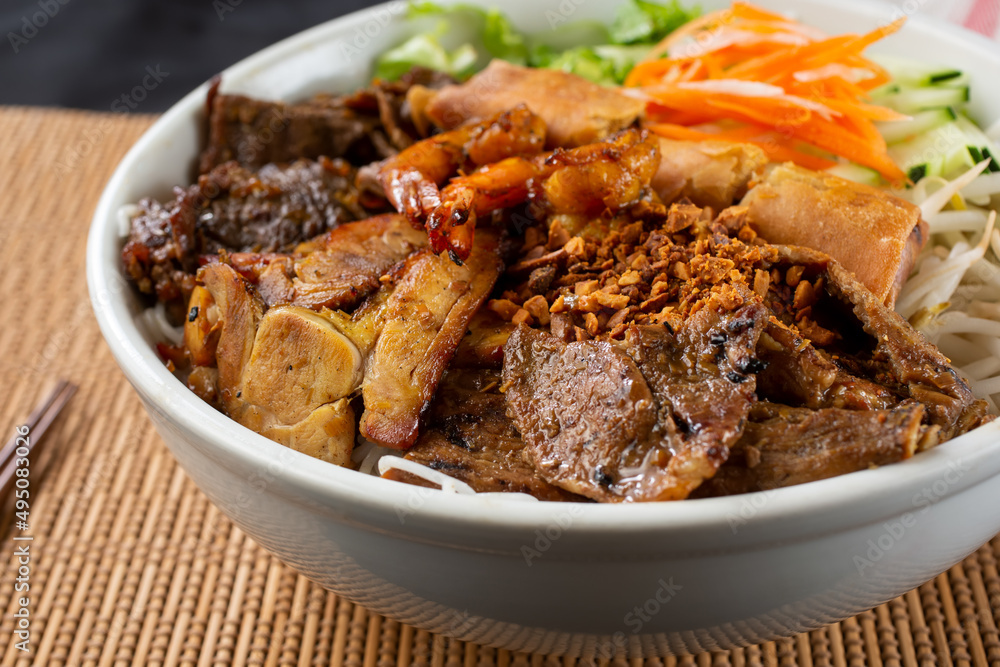 A closeup view of a bowl of Vietnamese vermicelli noodles known as Bún. A closeup view of a bowl of Vietnamese vermicelli noodles known as Bún.