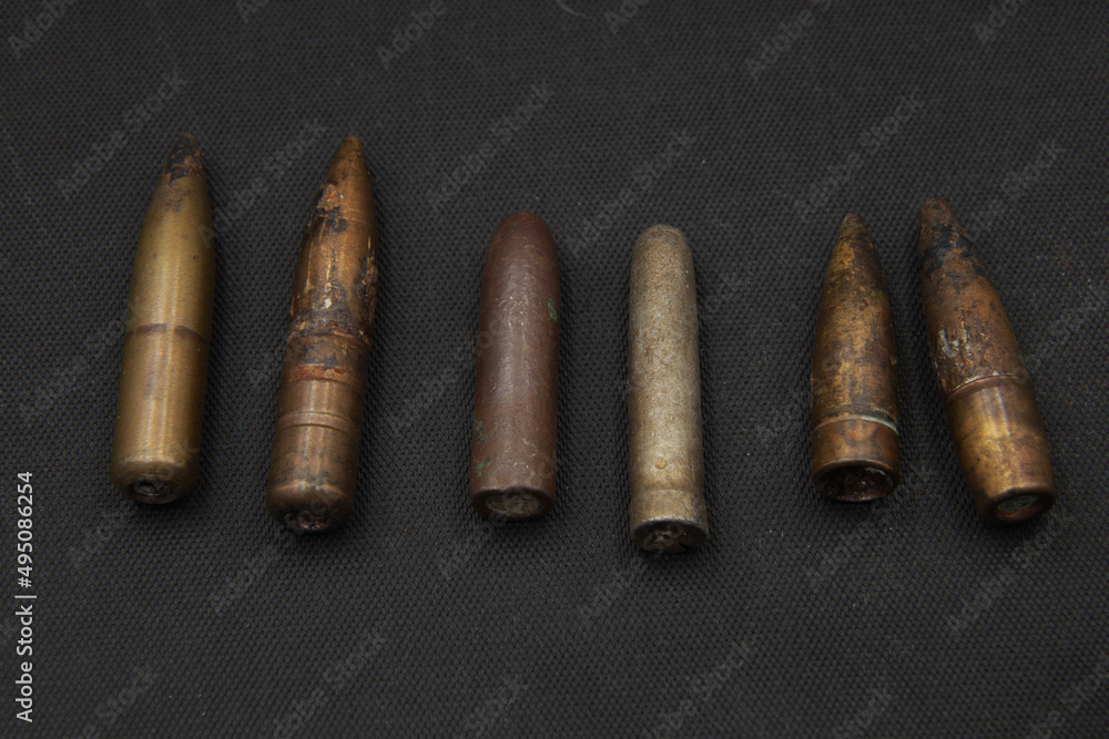 Old rifle bullets on black background Old rifle bullets on black background