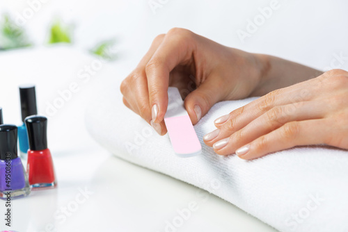 Woman using nail file and create nails shape