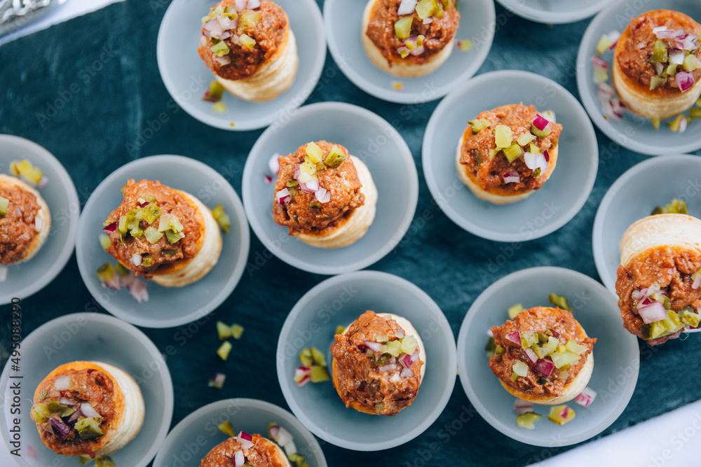 Beefsteak tatar on puff pastry buns. Food catering buffet. Beefsteak tatar on puff pastry buns. Food catering buffet.