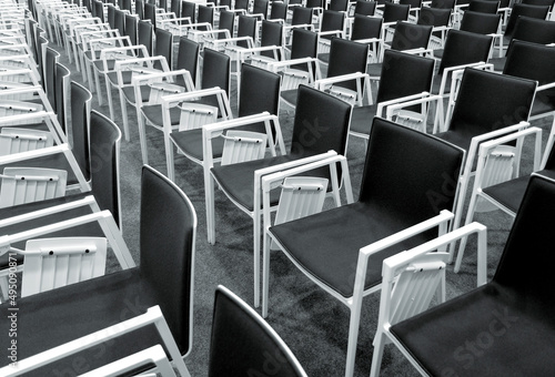 Interior of empty contemporary conference hall with rows of modern chairs