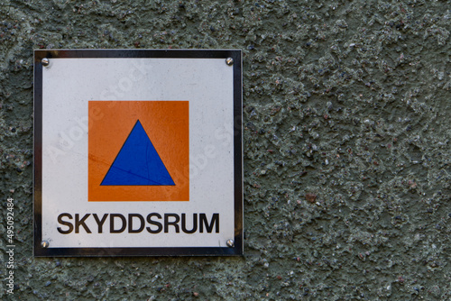 Shelter sign in swedish on apartment buliding