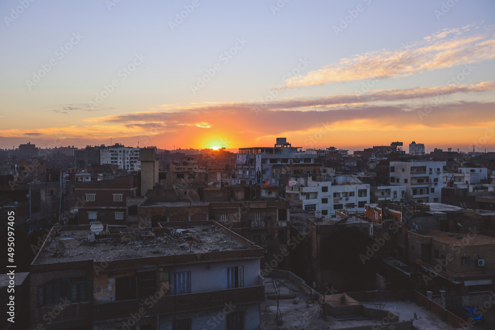 Sunset Cityscape View to the Giza City with the Colorful Sky and Local Buildings, Egypt