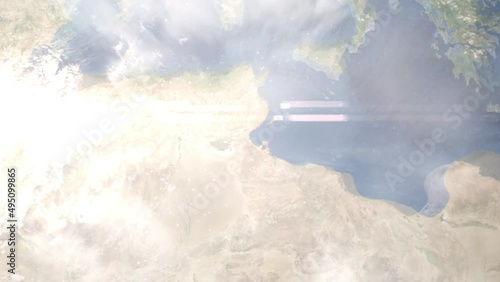 Earth zoom in from outer space to city. Zooming on Gabes, Tunisia. The animation continues by zoom out through clouds and atmosphere into space. Images from NASA photo