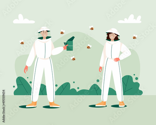 Man and woman in hat with protective fine mesh and in overalls with a bee smoker device. Beekeeping workers in uniforms.