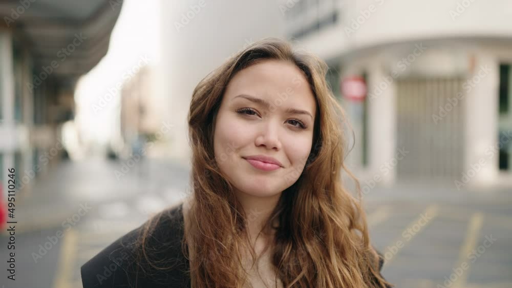 Young hispanic woman smiling confident standing at street Young hispanic woman smiling confident standing at street
