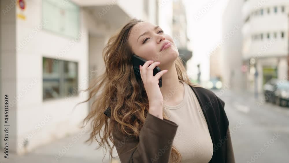 Young hispanic woman smiling confident talking on the smartphone at street Young hispanic woman smiling confident talking on the smartphone at street