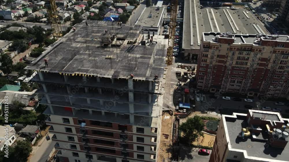 construction of a high-rise building with construction cranes. aerial 4k drone footage construction of a high-rise building with construction cranes. aerial 4k drone footage