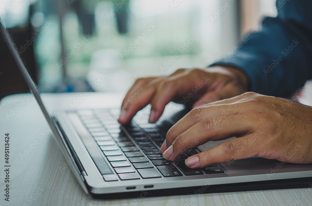 man using computer laptop searching internet, sending sms, using text messenger or online banking. man using computer laptop searching internet, sending sms, using text messenger or online banking.