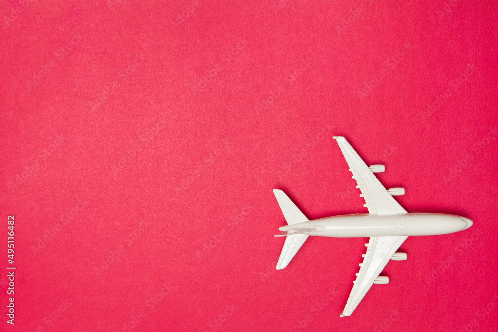 Airplane model. White plane on pink background. Travel vacation concept. Summer background. Flat lay, top view, copy space. Airplane model. White plane on pink background. Travel vacation concept. Summer background. Flat lay, top view, copy space.
