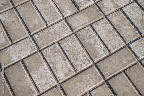 Efflorescence on gray paving slabs. Paving slabs on a construction site as a background