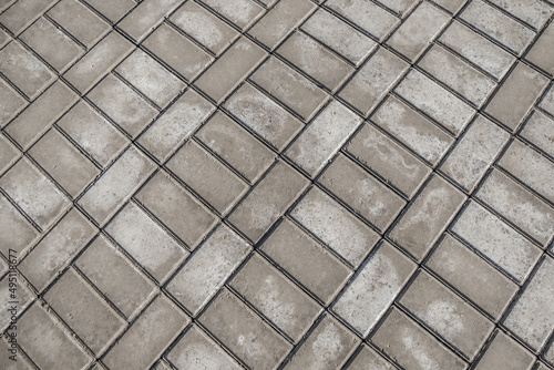 Paving slabs on a construction site as a background. Salt on gray paving slabs.