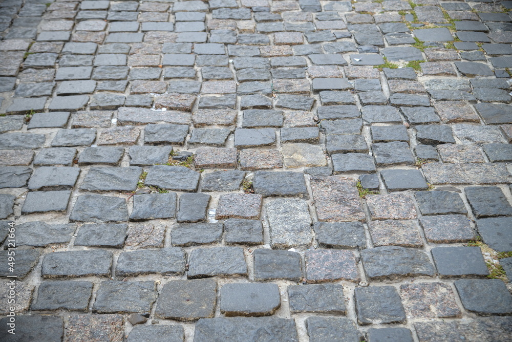 old paving slabs , stone pavement , the road is European style , the texture of the stones