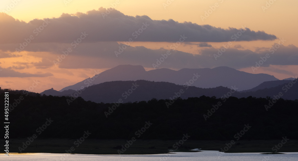Sunset over a lake in a tropical landscape