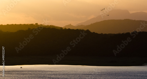 Sunset over a lake in a tropical landscape photo