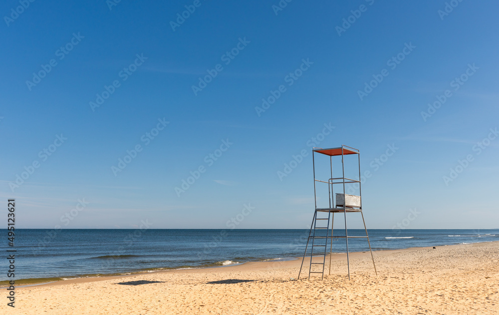 Lifeguard chair on empty sandy beach Baltic Sea Poland Lifeguard chair on empty sandy beach Baltic Sea Poland
