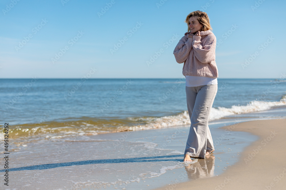 Walk on beach while cold weather