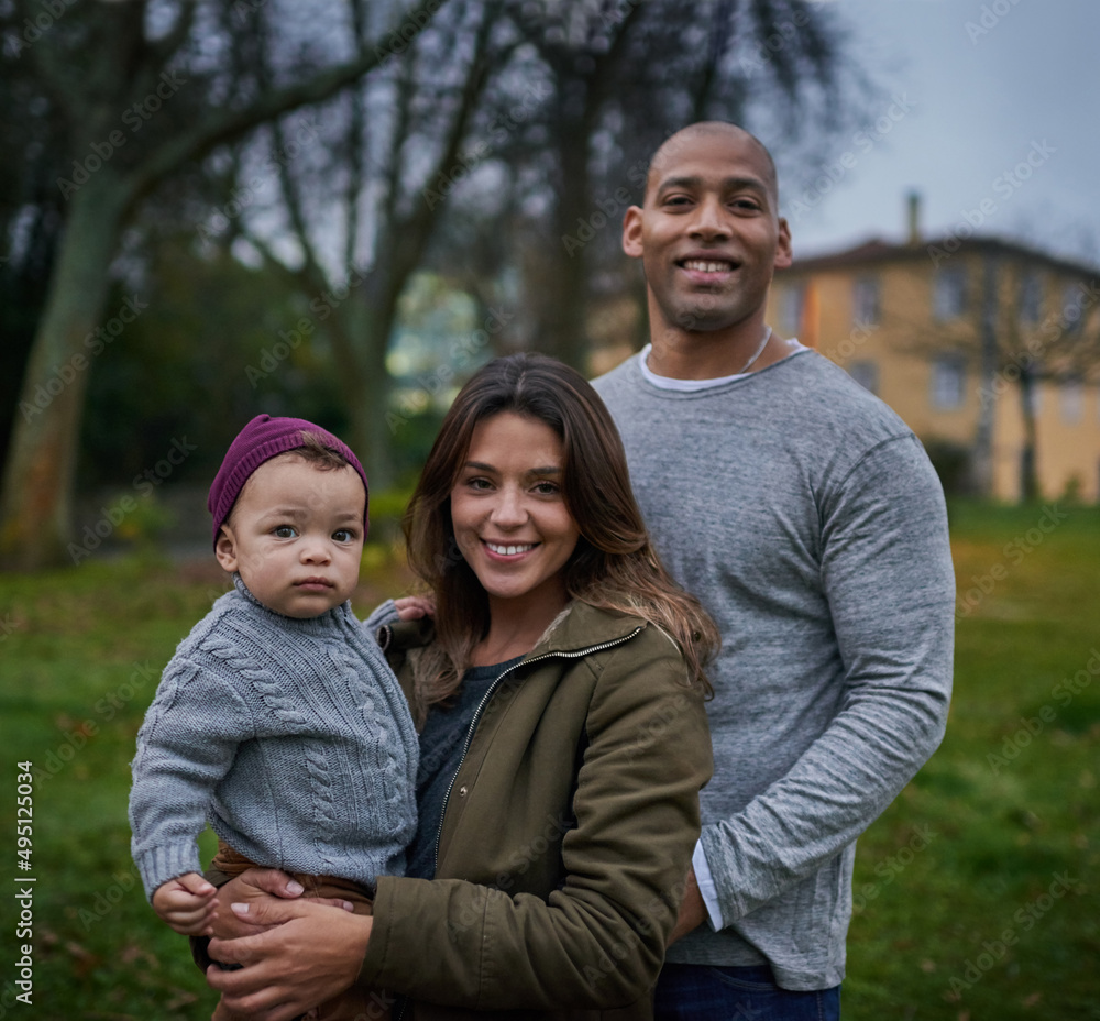 Hes little but hes brought the most joy into our lives. Portrait of a mother and a father bonding with their little son outdoors. Hes little but hes brought the most joy into our lives. Portrait of a mother and a father bonding with their little son outdoors.