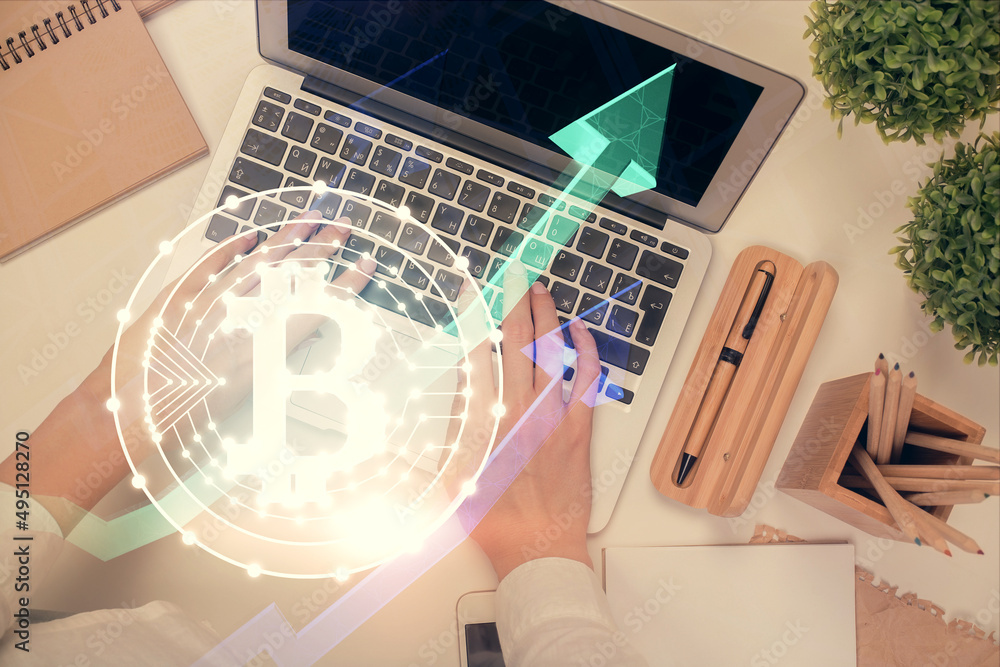 Double exposure of woman hands working on computer and blockchain theme hologram drawing. Top View. bitcoin cryptocurrency concept. Double exposure of woman hands working on computer and blockchain theme hologram drawing. Top View. bitcoin cryptocurrency concept.