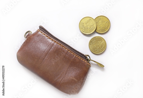 Fifty-cent coins by a leathern purse. European Union coins on white background. EU metal money. 50 Cent Euro Coins photo