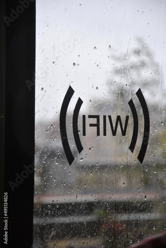 wifi inscription on the window with raindrops amsterdam