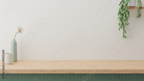 Minimal cozy counter mockup design for product presentation background. Branding in Japan style with wood top green counter and warm white wall with vase plant ceramic mug. Kitchen interior 3D render.