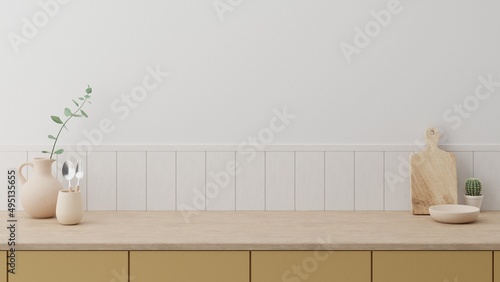 Minimal cozy counter mockup design for product presentation background or branding with bright wood top yellow counter white wall with vase plant jug mug chop fork spoon. Kitchen interior 3D render. photo