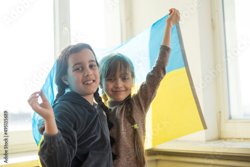 two little girls with ukraine flag