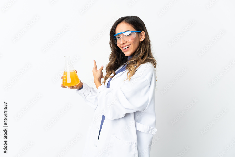 Young scientific woman isolated on white background pointing back Young scientific woman isolated on white background pointing back