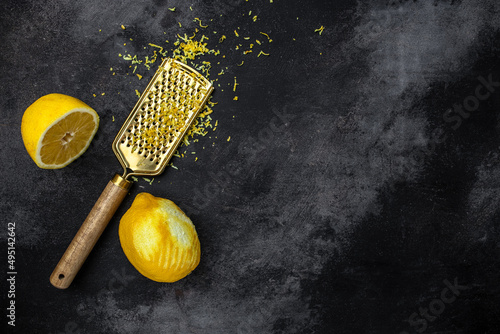 Bilde på lerret Grater peel and lemon zest Ready to Cook on a dark background, banner, menu, rec
