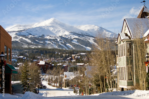 Looking down a street in the ski town of Breckenridge Colorado in winter with Peak 8 in the background in Summit County