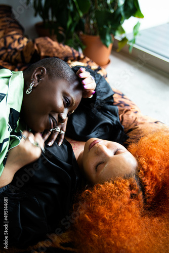 Black lesbian couple relaxing in bed