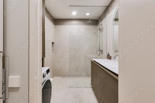 Modern minimalist bathroom interior design with marble stone tiles and khaki furniture