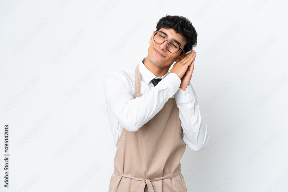 Restaurant Argentinian waiter isolated on white background making sleep gesture in dorable expression Restaurant Argentinian waiter isolated on white background making sleep gesture in dorable expression