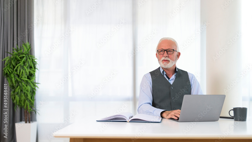Portrait of successful executive manager siting at his desk Portrait of successful executive manager siting at his desk