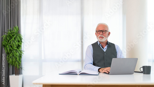Portrait of successful executive manager siting at his desk