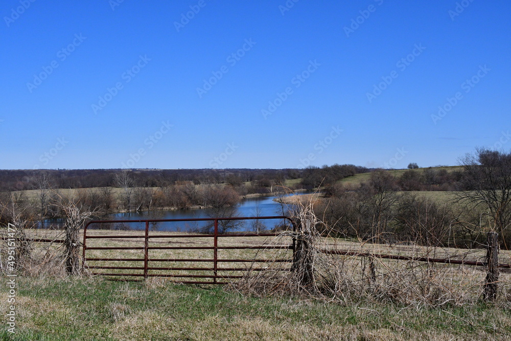 Farm Field Gate with a Lake in the Distance