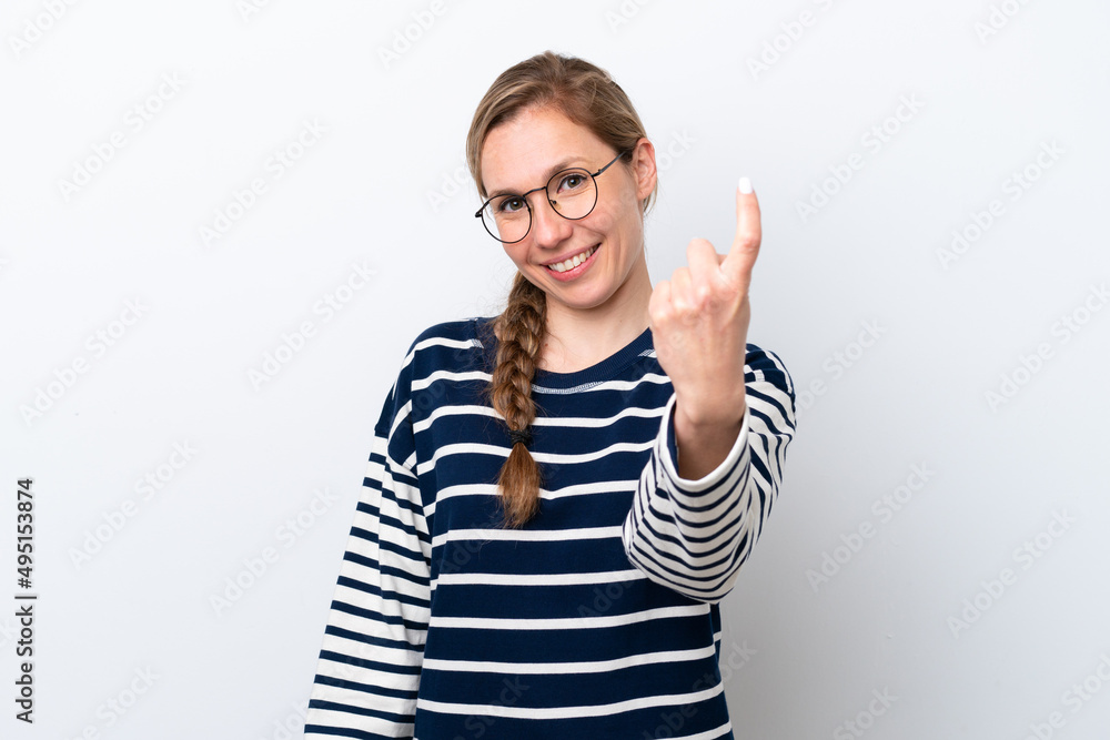 Young caucasian woman isolated on white background doing coming gesture Young caucasian woman isolated on white background doing coming gesture