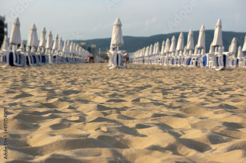 Beach with umbrellas and sun loungers